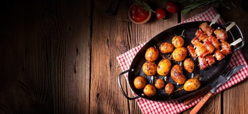 Rustic dates wrapped in bacon and young roasted potato