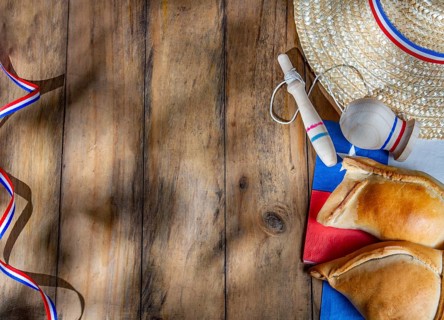 Food, Chilean independence day concept. fiestas patrias. Tipical baked empanadas, wine or chicha,