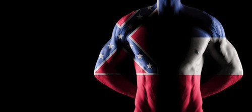 Mississippi flag on muscled male torso with abs, Mississippi bodybuilding concept, black background