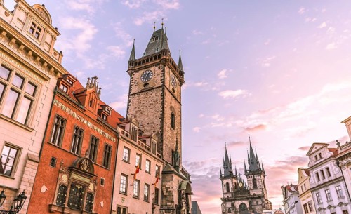 Image with the clock tower and the Church of our Lady before Tyn, at sunrise, in the Old Town