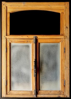 Vintage wooden and weathered rustic window frame with glass and black copy space