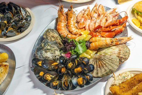 Plate of seafood for sale at a market in Bergen, Norway, Europe