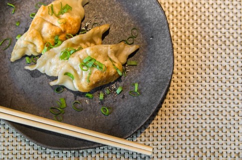 Beautiful gyoza or dumplings snack with soy sauce, selective focus, copy space