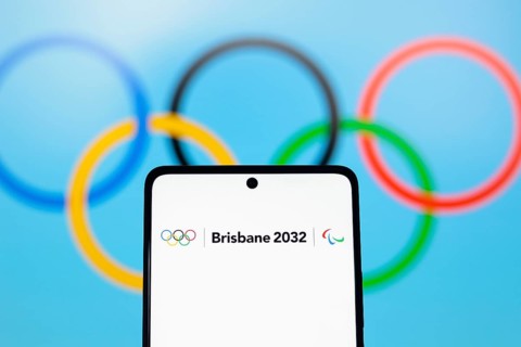 In this photo illustration, the 2032 Summer Olympics Games, Brisbane 2032 logo is displayed on a
