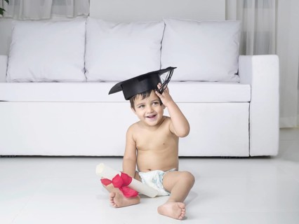 Baby holding degree certificate, MR#779O