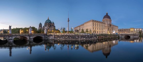 Panorama of Berlin Cathedral, the famous television tower and the rebuilt City Palace at dusk