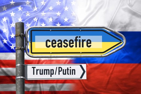 Signpost with lettering ceasefire on national colours of Ukraine in front of flag of the USA and