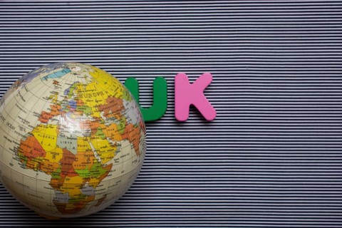 Abbreviation of united kingdom UK on wood background