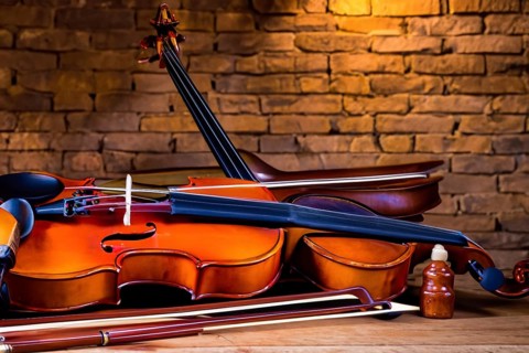 Interior of an old musical workshop with musical instruments and tools