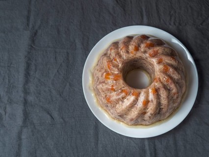 Homemade delicious jelly meat on table with dark gray linen tablecloth. Perfect jellied meat,