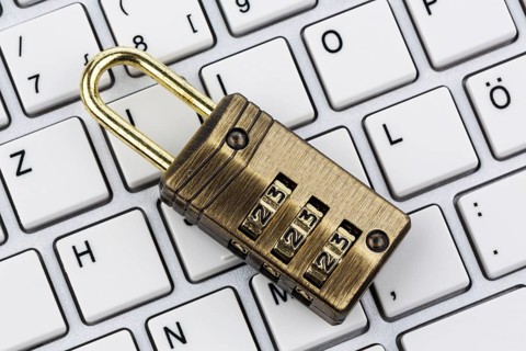 A padlock on a computer keyboard. Symbolic photo for data security and hacking Austria