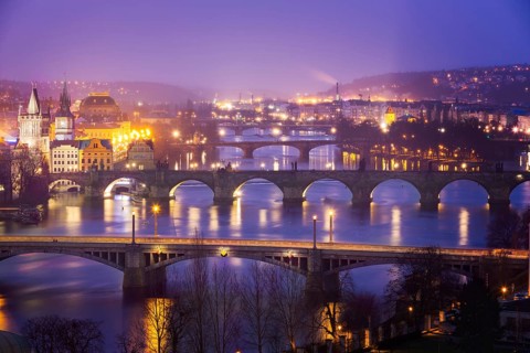 Vltava (Moldau) River at Prague with Charles Bridge at dusk, Czech Republic, Europe