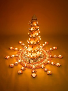 Diyas and flowers arrangement for diwali festival, India, Asia