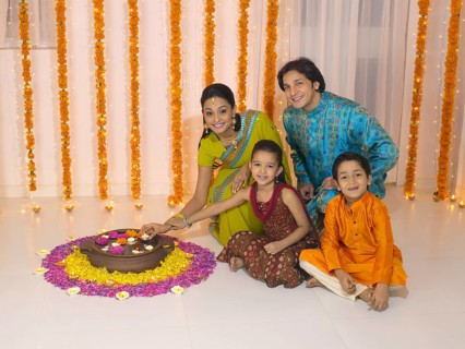 Woman lighting oil lamp with her family MR#779P, MR#779Q, MR#779R, MR#779S