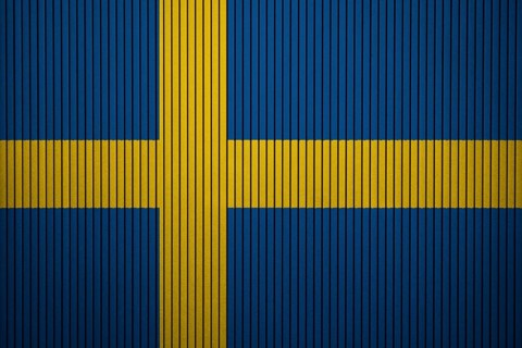 Sweden Flag painted on the cracked grunge concrete wall