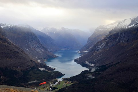 Rays of sunshine shine into Lake Lovatnet near Loen in Norway
