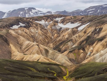 Rhyolite mountains, lava scree, Landmannalaugar, mountain peaks with snow, Fjallabak nature