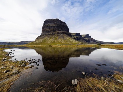 Rock massif Lomagnupur or Lómagnúpur, reflection in a pond, South Iceland, Iceland, Europe