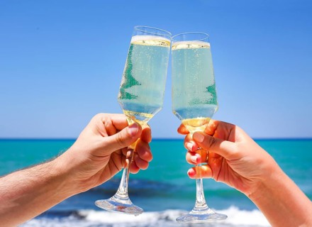 Two champagne glasses in man and woman hands
