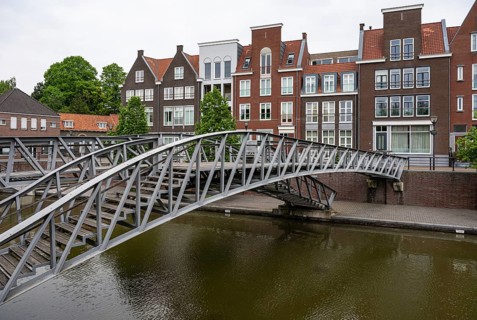 Hulst, Zeeland, The Netherlands, May 21, 2023, Pedestrian bridge and historical buildings at the