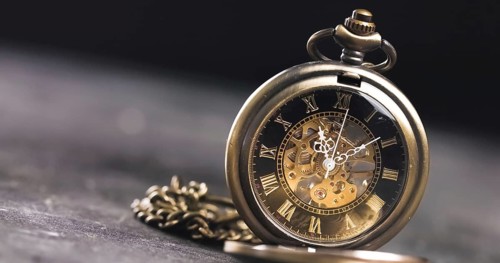 Antique old pocket watch dial close-up. Vintage hipster clock measuring time