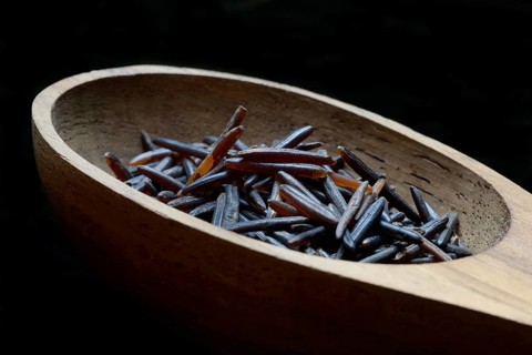 Rice, black wild rice in wooden ladle, Canada, North America
