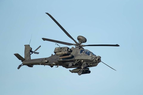 Agusta Westland AH-64 Apache helicopter aircraft in British Army air corps colours flying, England,