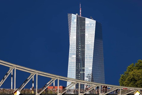 After a storm, the glass façade of the European Central Bank (ECB) shines in the sunlight,
