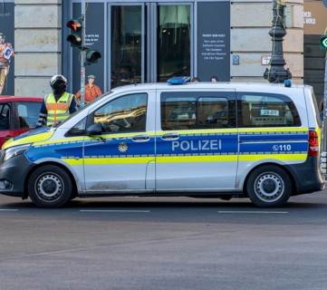 Police officer of the Berlin motorbike squad regulates traffic, Unter den Linden, Berlin, Germany,