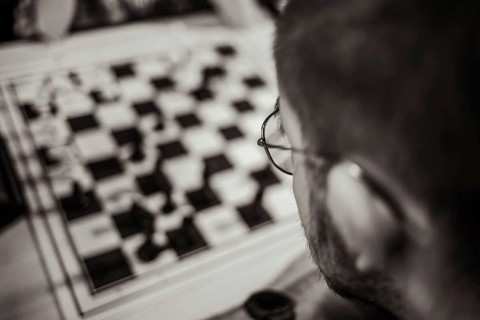 Chess player at the chessboard thinking about his next move, Leoben, Styria, Austria, Europe