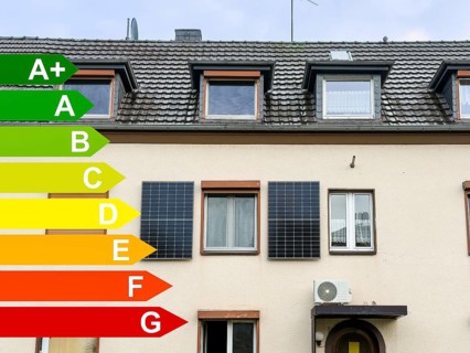 Energy efficiency classes, two solar panels on the façade of an apartment block in Hilden, Germany,