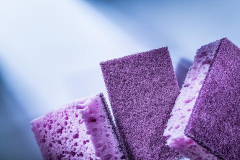 New dishwashing sponges on white background
