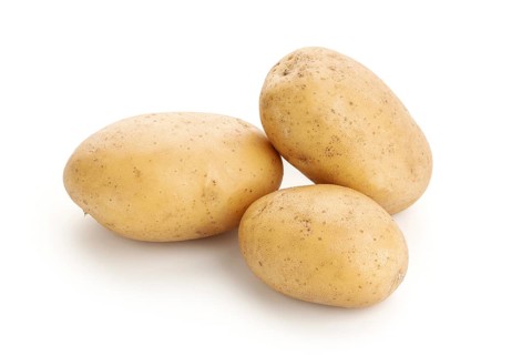 New potatoes isolated on white background. Raw potato