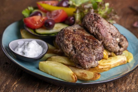 Greek bifteki with salad and chips