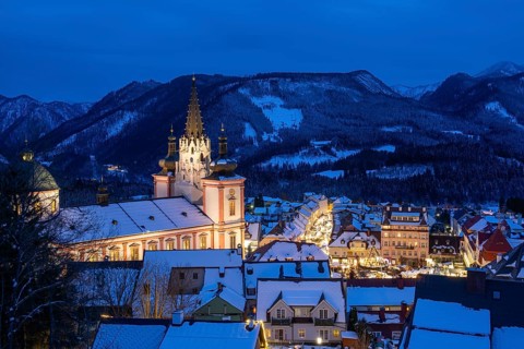 View of Mariazell illuminated for Christmas, basilica and main square, blue hour, Mariazell,