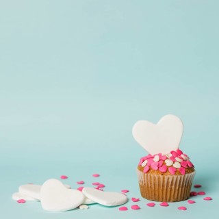 Tasty cake with decorative hearts
