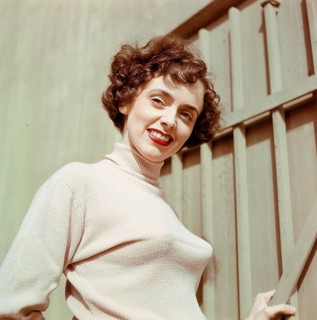 1950s jumper fashion. A swedish young woman wearing a typical 50s sweater. Under it she is wearing