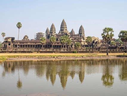 The iconic towers of Angkor Wat and the lake at the west gate, Siem reap, Cambodia, Asia