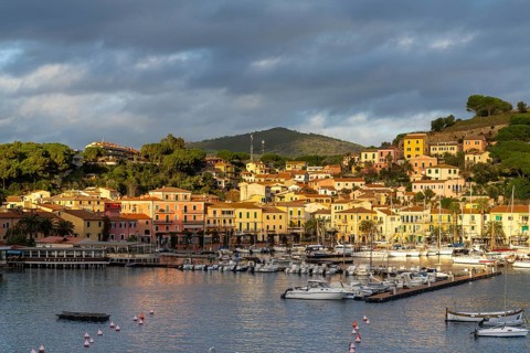 Porto Azzurro, Italy, 12 November, 2023: view of the harbor marina and Porto Azzurro village on