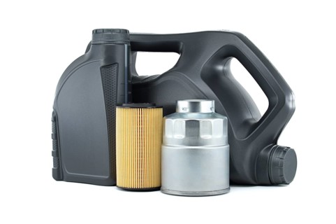 Vehicle engine oil filters and motor oil cans isolated on a white background. Containers, plastic