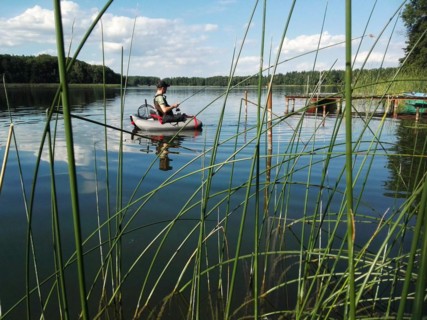 Angler with belly boat on Lake Lübbe