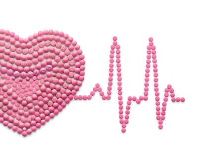 Creative medicine and healthcare concept of drugs and pills, against a white background ECG, a