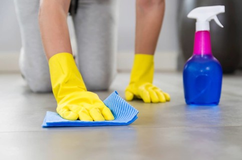 Great concept of domestic cleaning, woman cleaning the floor