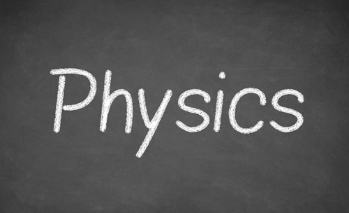 Physics lesson on blackboard or chalkboard. written in white chalk