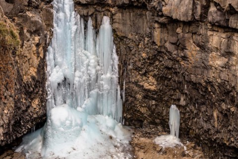 Looking down on frozen waterfall in deep crater located in Gyeonggi province of South Korea