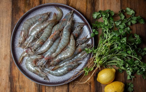 Food, Food, Raw shrimps prawns on gray plate with lemons and cilantro. Top view, wooden background