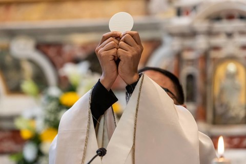 The elevation of the Sacramental Bread during the catholic liturgy