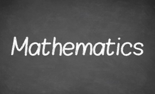 Mathematics lesson on blackboard or chalkboard. written in white chalk
