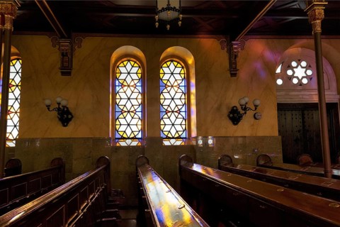 Incidence of light through stained glass windows, star, reflections, wooden benches, Great