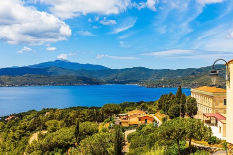 View of the Stella Gulf from Capoliveri, Monte Capanne in clouds in the background, Elba Island,